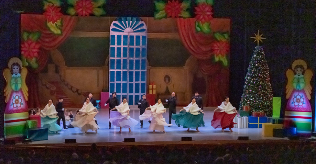 group of folk dancers on stage